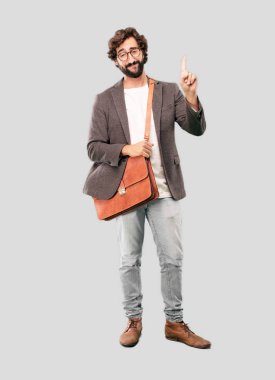 genç işadamı ceket giyen sakallı. Gurur veya başarı ifade.