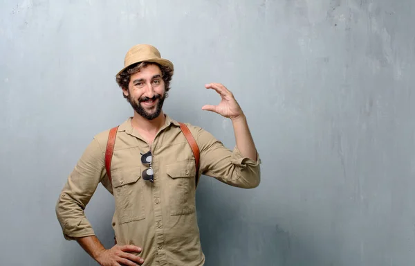 Young Traveler Man Tourist Smiling Satisfied Expression Showing Small Object — Stock Photo, Image
