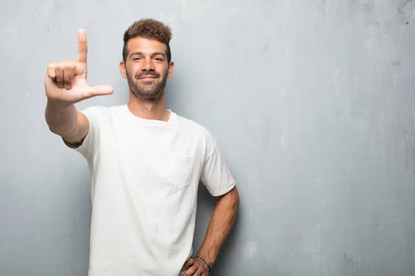 Young Handsome Man Gesturing Loser Fingers Mockingly Happy Proud Self — Stock Photo, Image