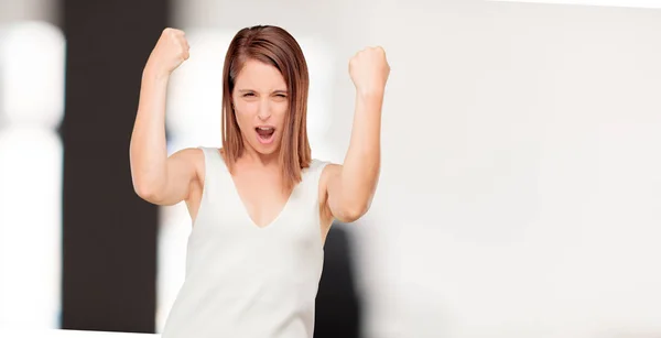 young pretty woman full body with strong sign