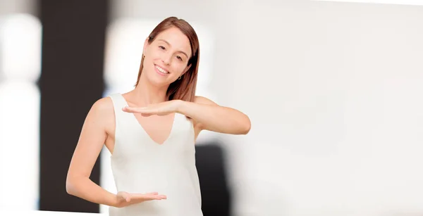 young pretty woman full body. Pointing and showing gesture.