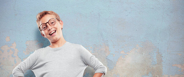 young blonde handsome boy Laughing out loud with head tilted backwards and happy, cheerful expression
