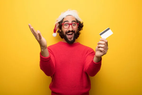 Young Crazy Bearded Man Wearing Red Glasses Santa Claus Hat — Stock Photo, Image
