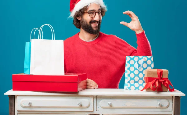 Young man with gifts. Christmas concept.