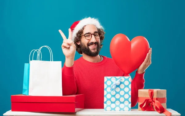 Young man with gifts. Christmas concept.