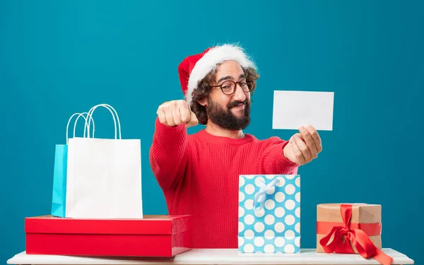 Young man with gifts. Christmas concept.