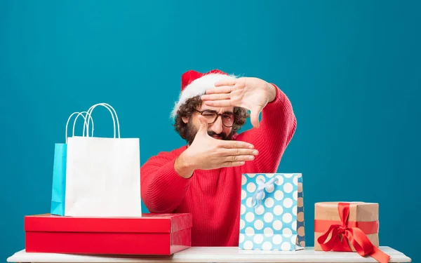 Young man with gifts. Christmas concept.