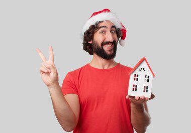Ev modeli olan genç deli adam. Noel kavramı. 
