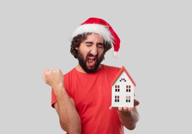 Ev modeli olan genç deli adam. Noel kavramı. 