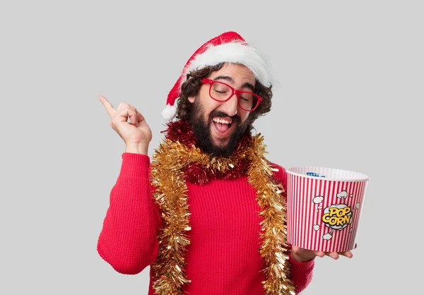 Young Crazy Man Eating Popcorn Christmas Concept — Stock Photo, Image