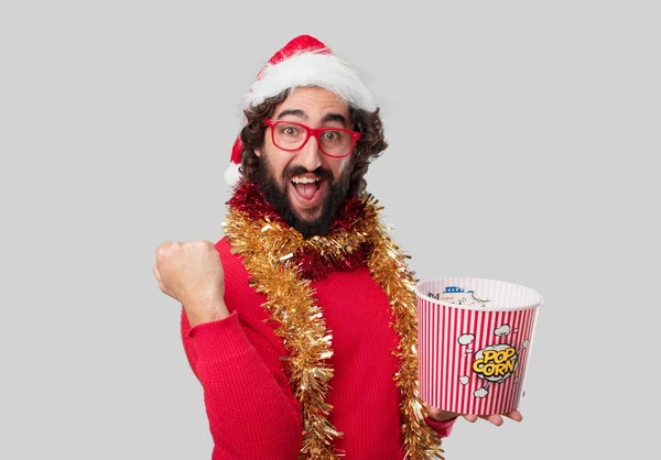 Young Crazy Man Eating Popcorn Christmas Concept — Stock Photo, Image