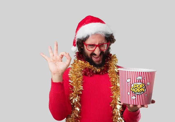 Ung Galen Man Äta Popcorn Jul Konceptet — Stockfoto