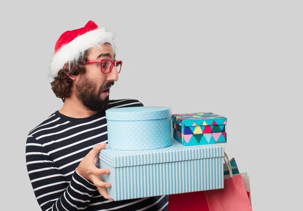 Junger Verrückter Mit Weihnachtsgeschenken Und Einkaufstaschen — Stockfoto
