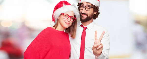年轻夫妇表达圣诞节的概念 不同图层中的情侣和背景 — 图库照片