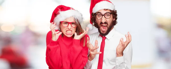 年轻夫妇表达圣诞节的概念 不同图层中的情侣和背景 — 图库照片