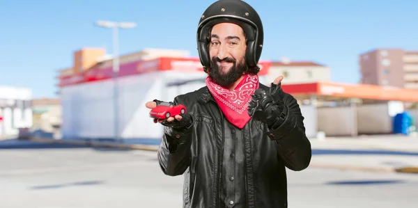 Motorbike Rider Holding Red Car Model — Stock Photo, Image