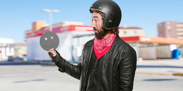 motorbike rider with a smiling icon face