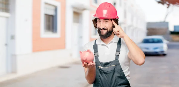 Joven Trabajador Con Una Alcancía —  Fotos de Stock