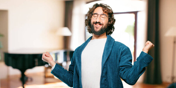 young man wearing bathrobe night suit satisfied