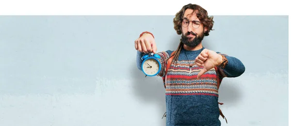 Young hippie man with an alarm clock — Stock Photo, Image