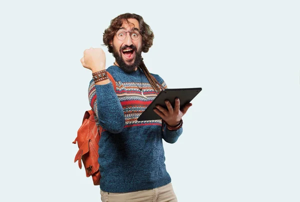 Young hippie man with a tablet — Stock Photo, Image