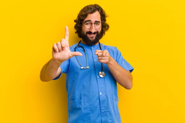 young nurse man with loser sign