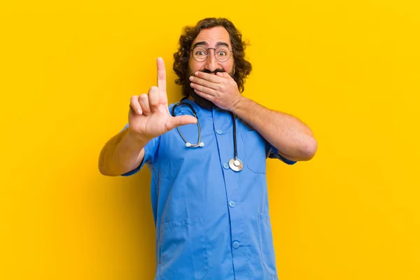 young nurse man with loser sign