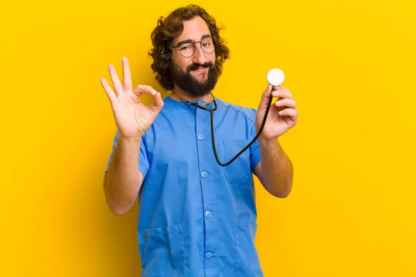 young nurse man against yellow background