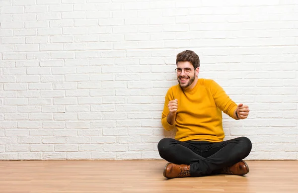 Young Handsome Man Sitting Home Floor Brick Wall Texture — Stock Photo, Image