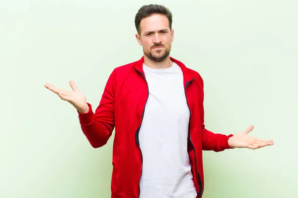 Young Handsome Sports Man Monitor Looking Puzzled Confused Stressed Wondering — Stock Photo, Image