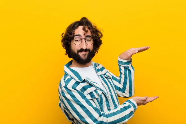 Young Crazy Man Holding Object Both Hands Side Copy Space Stock Picture