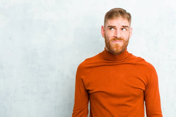 Young Red Head Man Wearing Turtle Neck Looking Puzzled Confused — Stock Photo, Image