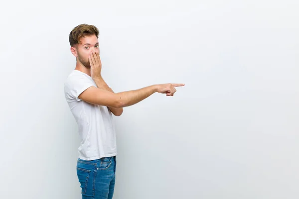 Young Man Feeling Happy Shocked Surprised Covering Mouth Hand Pointing — Stock Photo, Image