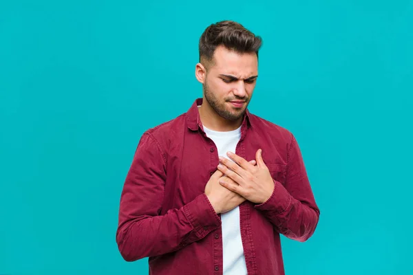 Young Hispanic Man Looking Sad Hurt Heartbroken Holding Both Hands — Stock Photo, Image