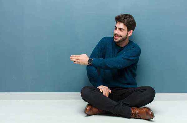 Young Handsome Man Sitting Floor Smiling Greeting You Offering Hand — Stock Photo, Image