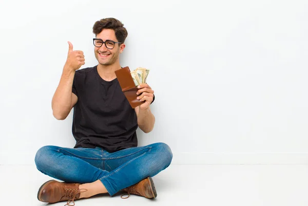 Young Handsome Man Wallet Sitting Floor Sitting Floor White Room — Zdjęcie stockowe