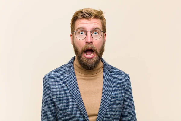 Young Blonde Businessman Feeling Terrified Shocked Mouth Wide Open Surprise — Stock Photo, Image