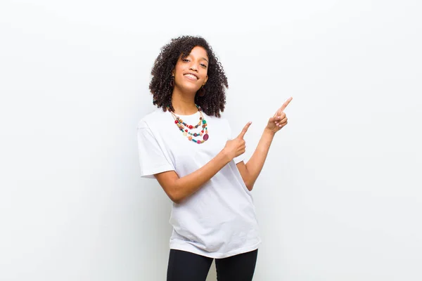 Young Cool African American Woman Smiling Happily Pointing Side Upwards — Stockfoto