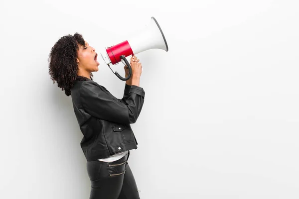 Young Pretty Black Woman Megaphone Wearing Leather Jacket White Wall — ストック写真