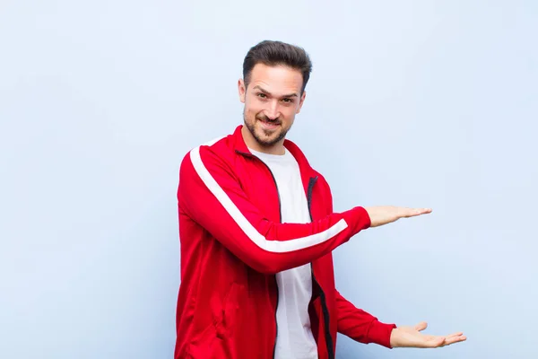 Young Handsome Sports Man Monitor Holding Object Both Hands Side — Stock Photo, Image