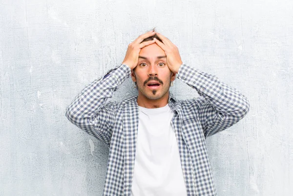 Young Handsome Man Feeling Horrified Shocked Raising Hands Head Panicking — Stockfoto