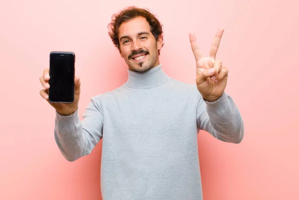 Young Handsome Man Smart Phone Pink Flat Wall — Stockfoto