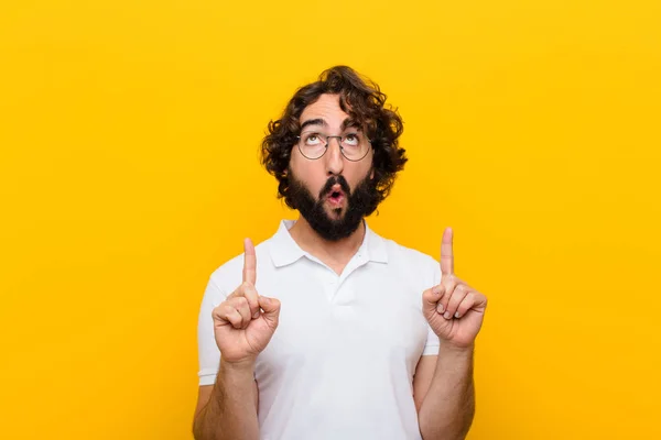 Young Crazy Man Looking Shocked Amazed Open Mouthed Pointing Upwards — Stock Photo, Image