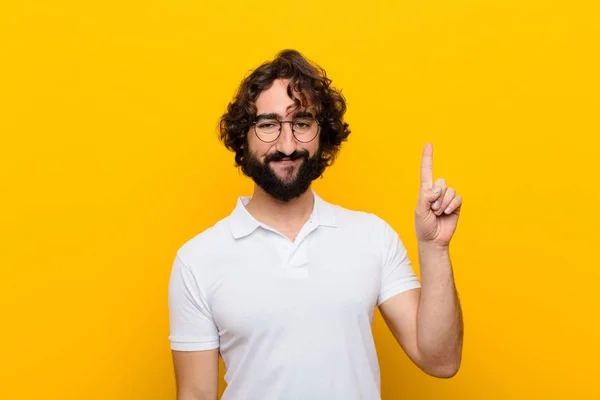 Young Crazy Man Smiling Cheerfully Happily Pointing Upwards One Hand — Stockfoto