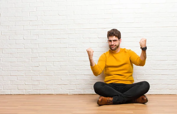 Young Handsome Man Sitting Home Floor Brick Wall Texture — Stock Photo, Image