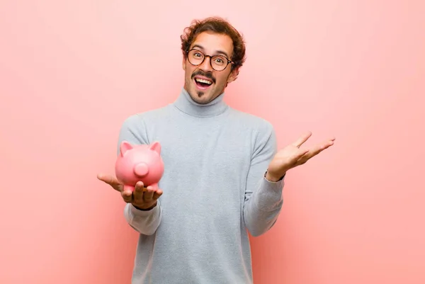 Young Handsome Man Piggy Bank Pink Flat Wall — ストック写真