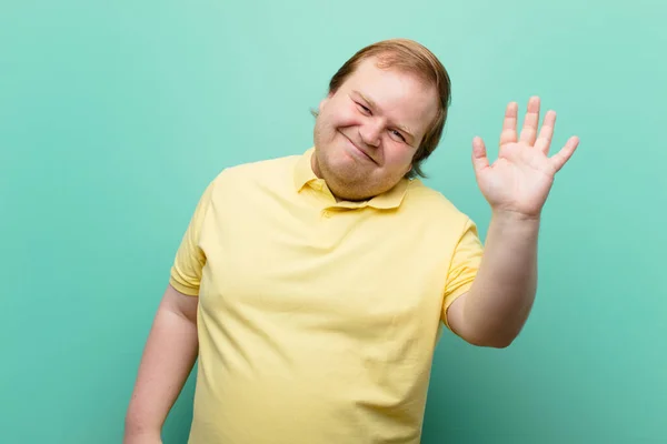 Young Big Size Man Smiling Happily Cheerfully Waving Hand Welcoming — Stock Photo, Image