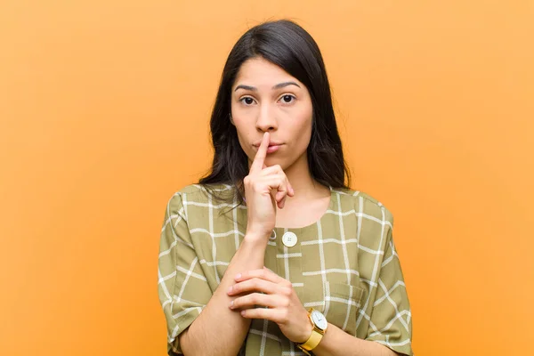 Young Pretty Hispanic Woman Looking Serious Cross Finger Pressed Lips — Stock Photo, Image