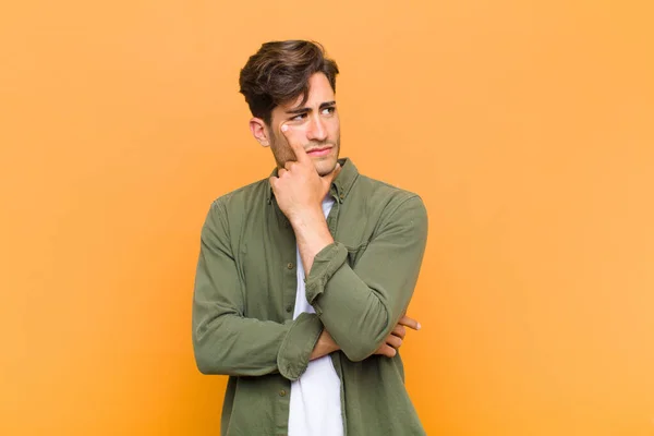 Young Handsome Man Concentrated Look Wondering Doubtful Expression Looking Side — Stock Photo, Image