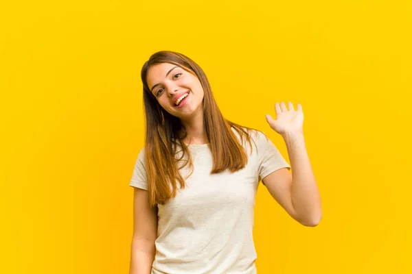 Young Pretty Woman Smiling Happily Cheerfully Waving Hand Welcoming Greeting — Stock Photo, Image